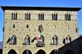 Palazzo del Comune, framed by the blue sky, in piazza del duomo in Pistoia illuminated by the sun. Royalty Free Stock Photo