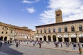 Palazzo del Podesta and Piazza Maggiore city square in Bologna with tourists