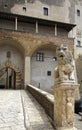 Palazzo Orsini and lion statue in ancient Italian city Pitigliano, Tuscany, Italy. Royalty Free Stock Photo