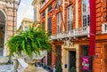 Palazzo rosso and a flower pot in Genoa, Italy...IMAGE