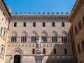 Palazzo Salimbeni in Siena, Italy with Statue of Sallustio Bandini Royalty Free Stock Photo