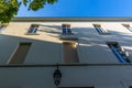 Pale beige facade with lantern, Butte-aux-Cailles, Paris, France Royalty Free Stock Photo