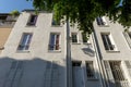 Pale beige facade with lantern, Butte-aux-Cailles, Paris, France Royalty Free Stock Photo