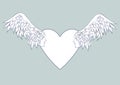 Angel wings with a human face in the frame in the shape of a heart Royalty Free Stock Photo