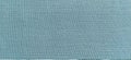 Pale blue fabric. A piece of woolen fabric laid out neatly on the surface. Interlacing and textile texture. Dress fabric