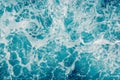 Pale blue green sea surface with waves and foam, abstract background Royalty Free Stock Photo