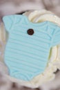 Pale Blue Onesie on Cup Cake