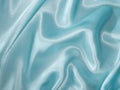 Pale blue satin with drapery - fabric background