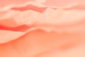 Pale coral red crumpled paper layers background