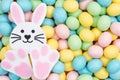 Easter egg candy with bunny rabbit background Royalty Free Stock Photo