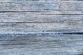 Pale faded brown and cool blue reclaimed pine wood surface with aged boards lined up. Weathered wooden planks on a wall Royalty Free Stock Photo