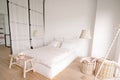 Pale Pink Bedroom in a Minimalistic Style with a Double Bed with Areas for Clothes and for Sleeping Royalty Free Stock Photo