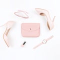 Pale pink female shoes and fashion accessories on white background. Fashion blogger concept flat lay.