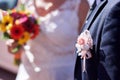 Pale pink flower decoration on the groom`s jacket Royalty Free Stock Photo