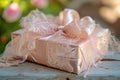 A pale pink gift box with a neatly tied bow on top, ready to be opened and admired, A rose gold gift box wrapped in a large, Royalty Free Stock Photo