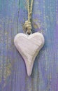 Pale Pink Rustic Wooden Heart On Purple Wooden Surface For Greet