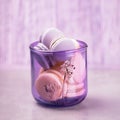 Pale purple glass with macaroons or macarons on the gray background. Glassware made of recycled glass, eco friendly concept