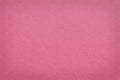 Pale red-violet cardboard surface. Paper texture with cellulose fibers. Light red background with a pastel tint. Paperboard Royalty Free Stock Photo