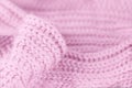 Pale soft pink knitted wool texture. Close up wool background. Warm and cozy. Blurred delicate background