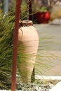 Terracotta urn hanging on a chain Royalty Free Stock Photo