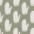 Pale tones seamless pattern with white winter ornament mittens shapes. Grey background. Xmas backdrop