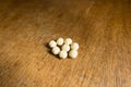 Pale yellow spherical tablets of probiotics Royalty Free Stock Photo