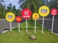 sign board of Im3 ooredoo, Indosat ooredoo, 4g plus kuat with trees and roads