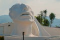 Palenque, Chiapas, Mexico. White head sculpture on the street. Huge monument located near the bus station in the city.