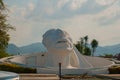 Palenque, Chiapas, Mexico. White head sculpture on the street. Huge monument located near the bus station in the city.