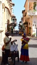 Palenquera woman and a peddler in Cartagena