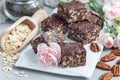 Paleo chocolate energy bars with rolled oats, pecan nuts, dates, chia seeds and coconut flakes, horizontal Royalty Free Stock Photo