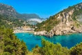 Paleokastritsa beach and village on Corfu island, Greece. Picturesque seashore with turquoise crystal water, pebble Royalty Free Stock Photo