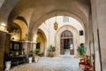 Historical arch in center of italian city with lantern and home entrance