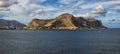 Picturesque panoramic landscape of ancient Palermo. View from the sea. Mountain range in the background against vibrant sky