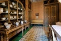 Old dining room with antique ceramic dishes, plates, tureens in Palazzo Alliata Villafranca, Baroque aristocratic home