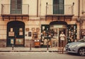 Owner of antique store waiting for customers of old artworks, jewelry, ceramics and vintage stuff Royalty Free Stock Photo