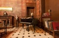 Piano and antique books inside historic Palazzo Alliata di Villafranca, Baroque aristocratic home with vintage interiors