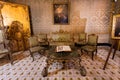 Room for relaxing with antique trellis and furniture, in Palazzo Alliata di Villafranca, a Baroque aristocratic home