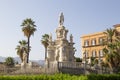 Panoramic view from the ground of a statue that is located just in front of the Palazzo dei Normanni, Palermo