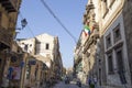 Panoramic view of a central street of Palermo, Sicily, with its flags and its old buildings