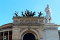 Palermo, Italy, September 07, 2019 - Politeama Theater in the city center with a statue dedicated to Ruggiero Settimo in the foreg