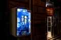 The condom vending machine to prevent venereal disease and for birth control with bright blue colours at night