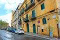 Palermo, Sicily, Italy - Apr 11th 2019: Generic street in Sicilian Palermo. Parking cars, buildings with graffiti. Dirty city