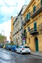 Palermo, Sicily, Italy - Apr 11th 2019: Generic streets in Italian Palermo. Parked cars, typical buildings. Dirty city streets.