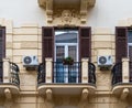 Palermo, Sicily, Italy - Facade with balcony and airco ventilation and wooden window shutters