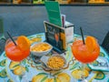 Palermo Sicily Italy  June 26, 2018:  Two glasses Aperol spritz cocktail  on a ceramic table in a street cafe in Italy Royalty Free Stock Photo