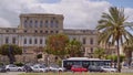 View of Porta dei Greci or Door of the Greeks hard traffic of Palermo, sunny day