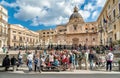 Tourists visiting the Pretoria Fountain in the Square of Shame in Palermo. Santa Caterina church in background. Royalty Free Stock Photo