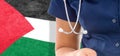 Palestine flag female doctor with stethoscope