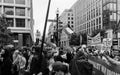 Washington, DC - 10-14-2023: Palestine Protest March in black and white with protestor on street lamp